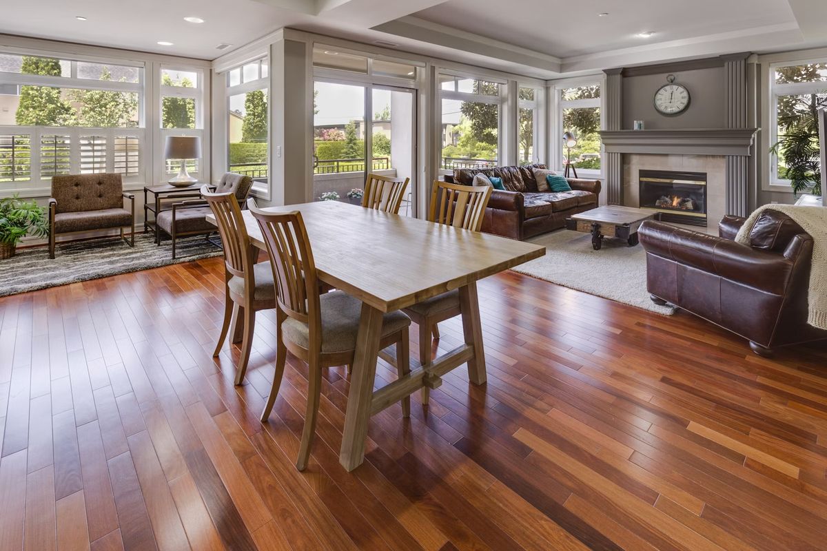 Warm mid-tone hardwood floor under a dining table — a popular refinished look in Middle Tennessee homes